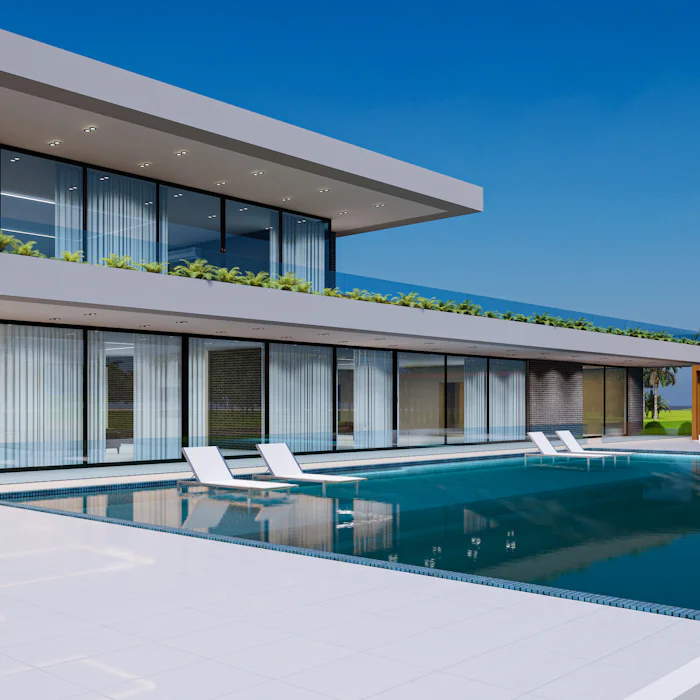 A garden pool beside a house in the early evening.