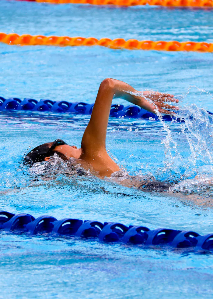 A lane-marked lap pool in a public sports facility.