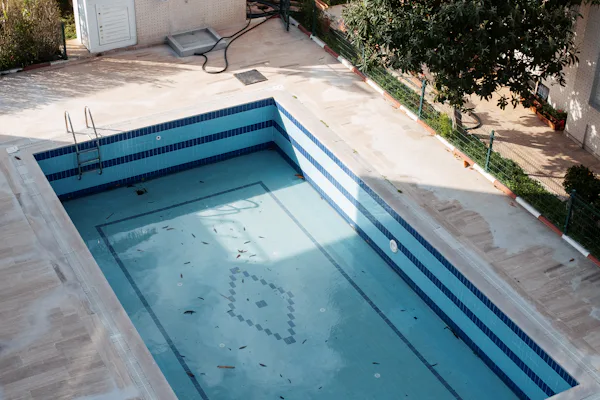 An older swimming pool awaiting refinishing.