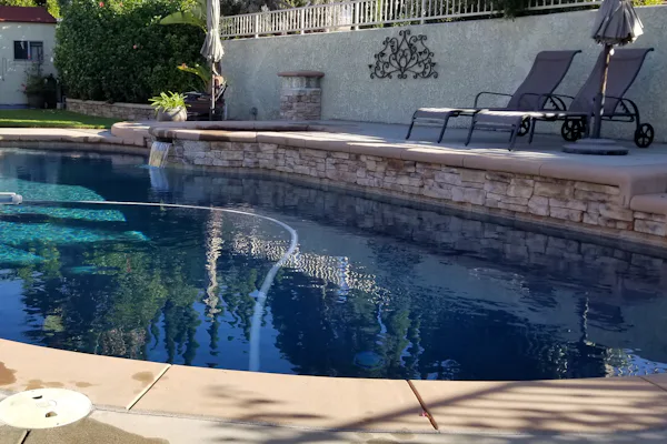 A private swimming pool in the garden of a family home.